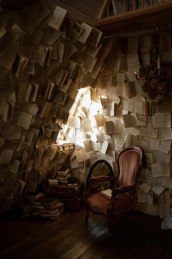 A cozy attic reading nook with vintage decor, illuminated by soft daylight through a window.